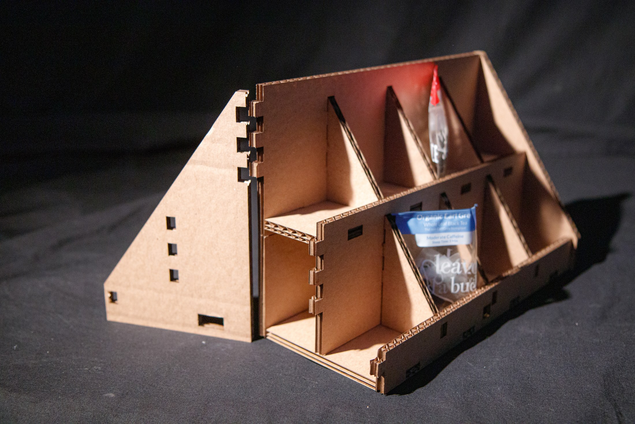 Rear three-quarter view of the layered cardboard assembly